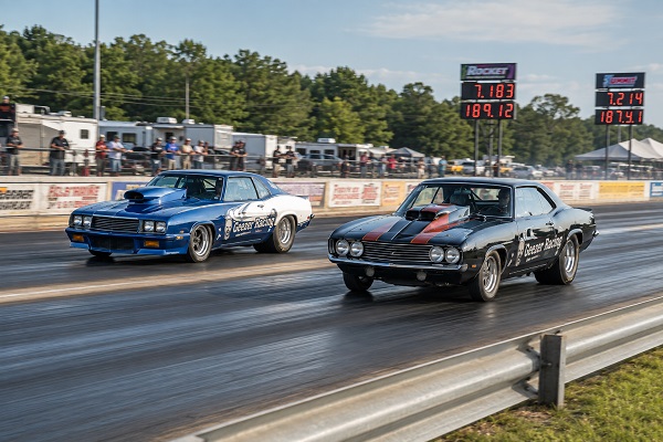 Two Grumpy Old Geezer Racing drag cars racing side by side near the finish line